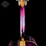 Close-up of a guitar neck with a purple and gold finish on a black background, featuring 'Tone Shop' branding.