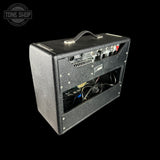 Guitar amplifier with visible brand logo on a black background