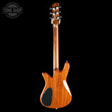 Wooden electric guitar on a black background with 'Tone Shop' logo.