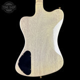 Back view of a guitar body with a visible brand logo in the corner.