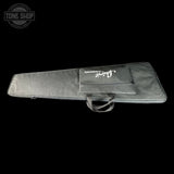 Gray guitar case with Fender logo on a black background