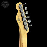 Guitar headstock with tuning pegs on a black background, featuring the Tone Shop logo.