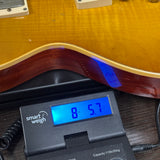 Gibson Custom 1959 Les Paul Standard Reissue Light Aged Dirty Lemon on scale displaying weight.