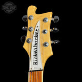 Guitar headstock with 'Rickker & Co.' branding on a black background