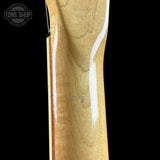 Close-up of a guitar neck with a visible brand logo in the corner.