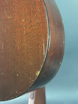 Close-up of a wooden surface with visible grain and imperfections.