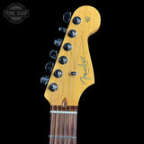 Fender guitar headstock with brand logo on a black background