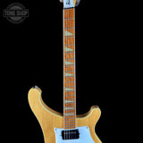 Electric guitar with a visible brand logo on a black background