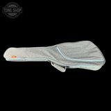 Gray guitar case with a visible brand logo on a black background