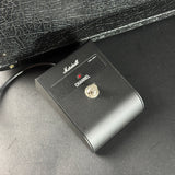 Marshall guitar pedal switch on a textured surface