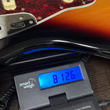 Used Fender Vintera Jaguar 3-Color Sunburst on scale displaying weight.