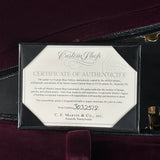 Certificate of Authenticity for a Martin Custom Shop guitar on a dark background