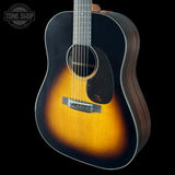 Acoustic guitar with a sunburst finish on a black background, featuring the Tone Shop logo.