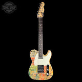 A Fender Telecaster electric guitar with a colorful graffiti-style body finish, cream pickguard, and maple neck, shown against a solid black background with a Tone Shop watermark in the top left corner.