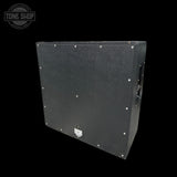 Black guitar amplifier cabinet with 'Tone Shop' logo in the corner.