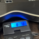 Used Gretsch 5260 Electromatic Jet Baritone on scale displaying weight.