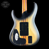 Electric guitar with a sunburst finish on a black background, featuring the Tone Shop logo.