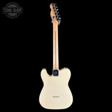 A classic Fender Telecaster electric guitar shown from the back, featuring a cream-colored body, a natural wood neck, and black hardware, set against a solid black background.