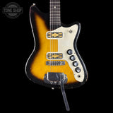 Vintage electric guitar with a sunburst finish on a black background, featuring the Tone Shop logo.