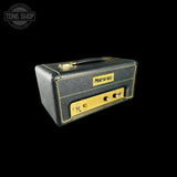 Marshall amplifier head with gold accents on a black background