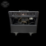 Guitar amplifier with visible brand logo on a black background