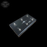 Black guitar effects pedal with control knobs on a black background, featuring 'Tone Shop' branding.