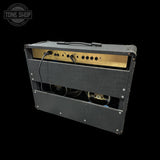 Guitar amplifier with visible brand logo on a black background