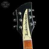 Guitar headstock with 'Rickenbacker' branding on a black background