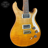 Front angle of Used PRS TSG Anniversary Wood Library Artist DGT Gold Storm Fade/Braz RW.
