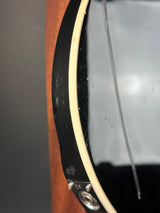 Close-up of a guitar's soundhole and body