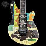 Colorful electric guitar with abstract design on a black background, featuring the Tone Shop logo.