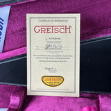 Greiss Certificate of Authenticity on a purple guitar case
