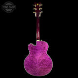 Purple electric guitar on a black background with 'Tone Shop' logo.