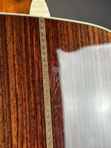Close-up of a wooden guitar with inlaid string dot design