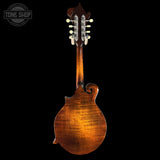 Wooden mandolin on a black background with 'Tone Shop' logo.