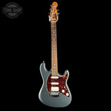 Electric guitar with a silver body and red pickguard on a white background
