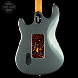 Gray electric guitar with a flame pattern on the back, brand 'Tone Shop' visible.
