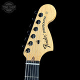 Fender Stratocaster headstock on a black background