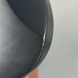 Close-up of a black object with a gray background