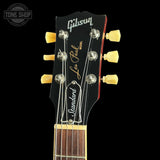 Gibson Les Paul guitar headstock with brand name on a black background