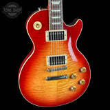 Electric guitar with a sunburst finish on a black background, featuring the Tone Shop logo.