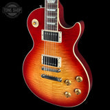 Electric guitar with a sunburst finish on a black background, featuring the Tone Shop logo.