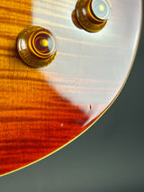 Close-up of a guitar's soundhole with a clear cover