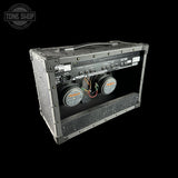 Guitar amplifier with visible brand logo on a black background