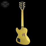 Gold electric guitar with a star design on a black background, featuring 'Tone Shop' branding.