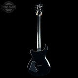 A black electric guitar shown from the back, featuring a glossy finish, a visible Gotoh logo on the body, and a Tune Shop watermark in the upper left corner against a solid black background.