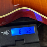 Used Collings CL Custom 390 Sunburst on scale displaying weight.