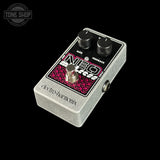 Electro Harmonix NEO overdrive guitar pedal in silver aluminum with a black faceplate, pink and white graphic, and black knobs, shown on a black background.