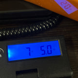 Used Epiphone Korina Explorer on scale displaying weight.