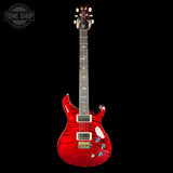 Red electric guitar with a black background